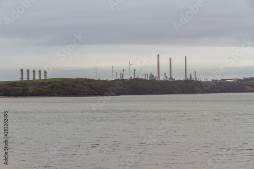 Chimneys of power station and oil refinery, landscape.