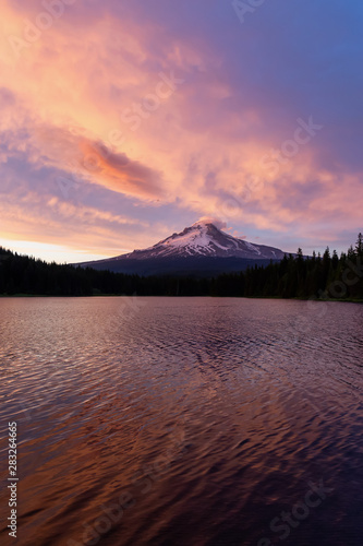 Beautiful Landscape View of Mt Hood during a dramatic cloudy sunset. Taken from Trillium Lake, Mt. Hood National Forest, Oregon, United States of America.