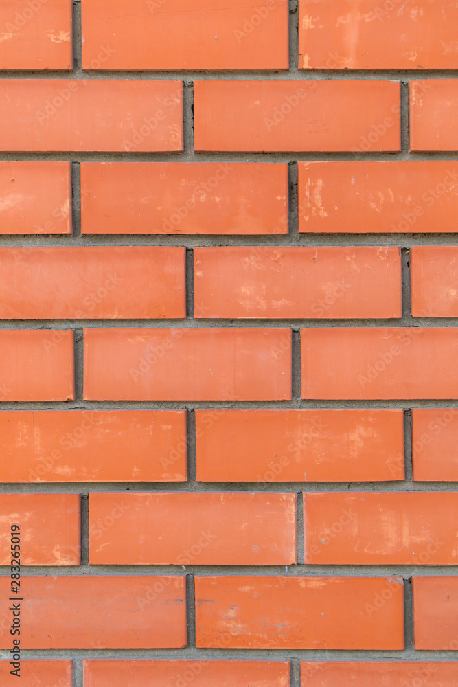 background of neatly stacked red bricks background of neatly stacked red bricks