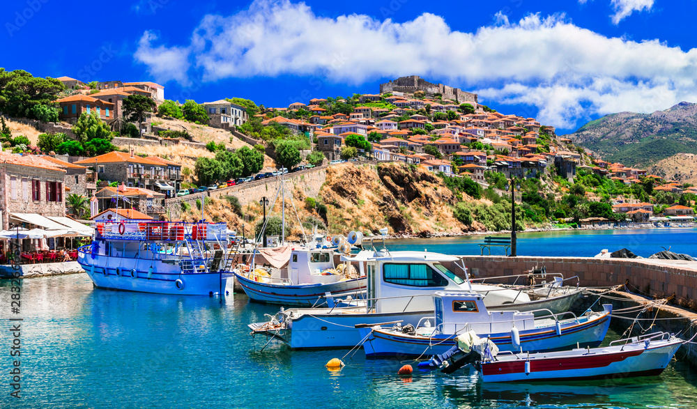 Best of Greece - scenic Lesvos island. Molyvos (Mythimna) town. view of port and medieval castle on hill top