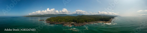 Beautiful Aerial Panoramic Landscape View of the Rocky Pacific Ocean Coast in the Southern Vancouver Island during a sunny summer day. Taken between Victorial and Port Renfrew, BC, Canada. © edb3_16