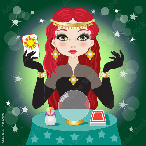 Beautiful fortuneteller with red hair on a green background with crystal ball and tarot