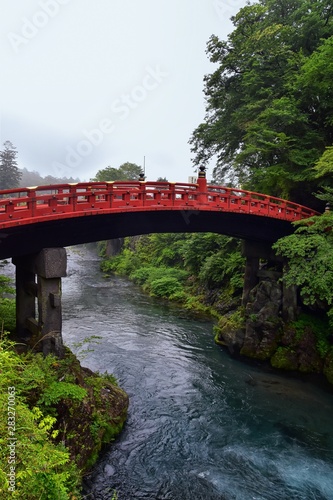 Shinkyo Bridge over the Daiwa River in Nikko outside of Tokyo, Japan in summer with cloud cover. Aisa. © Jeremy