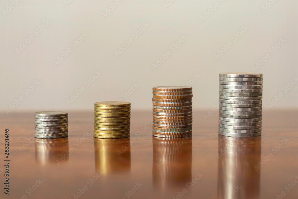 Stack the coins into steps. Business growth concept Stack the coins into steps. Business growth concept
