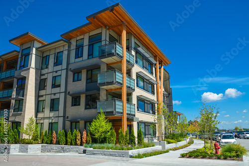 Brand new apartment building on sunny day in British Columbia, Canada.