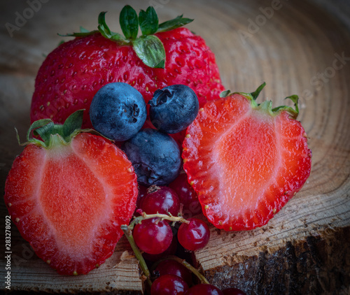 Close-up view of mixed, assorted berries blackberry, strawberry, background. Colorful and healthy concept.