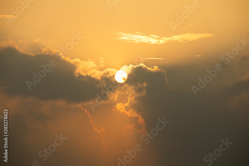 Close up of Sun rise in orange sky during cloudy in early morning