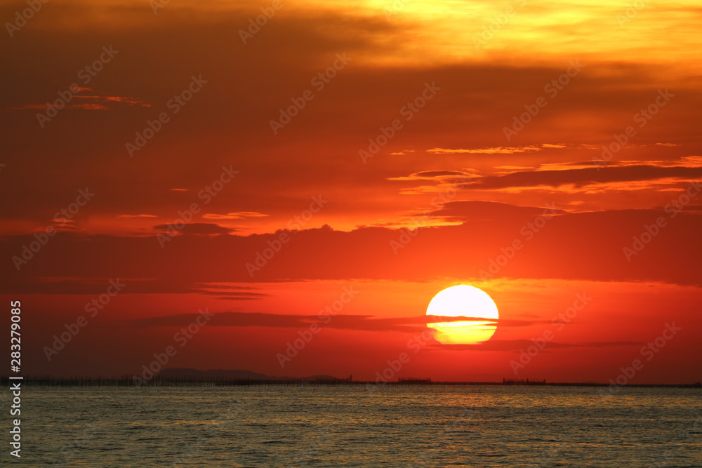 sunset on red yellow sky back soft evening cloud over horizon sea - obrazy, fototapety, plakaty 