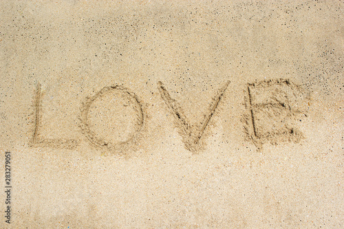 Love text on the beach. © phatthanit