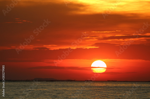 Fototapeta Naklejka Na Ścianę i Meble -  sunset on red yellow sky back soft evening cloud over horizon sea