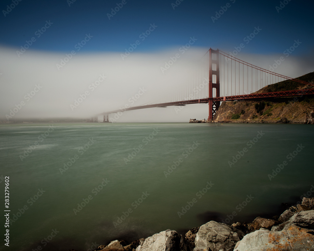 Fototapeta premium Foggy morning on the Golden Gate Bridge Longe exposure 