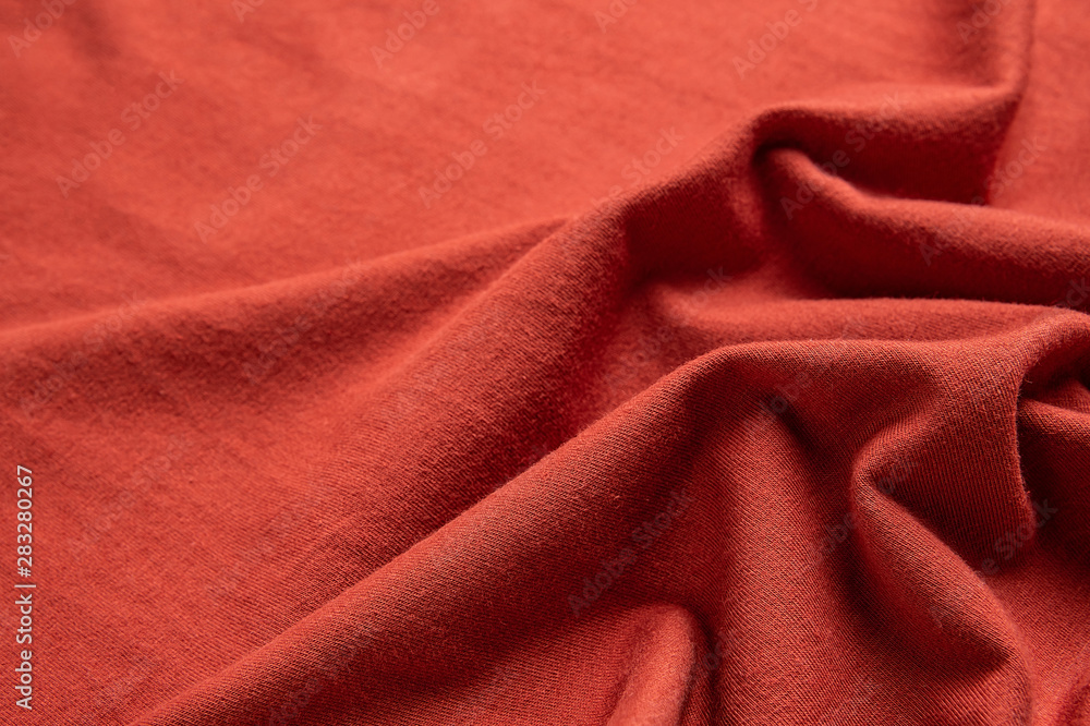 Fototapeta premium Orange-red cotton knit fabric texture material