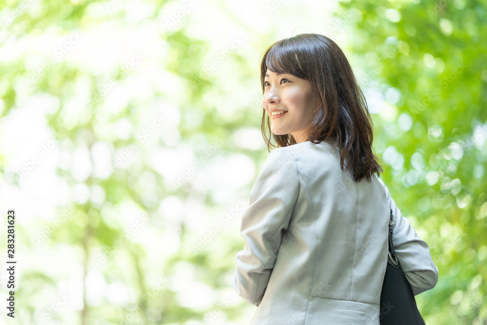 portrait of asian businesswoman walking in sidewalk portrait of asian businesswoman walking in sidewalk