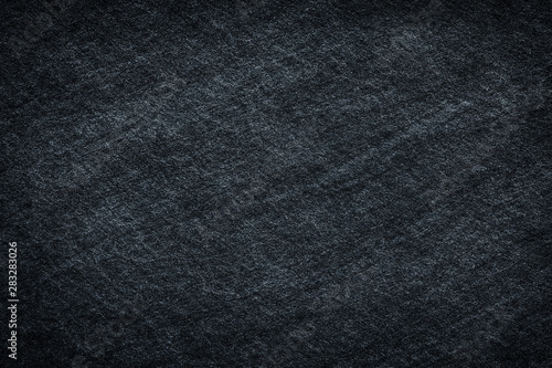 Dark gray black slate stone surface texture background © prapann