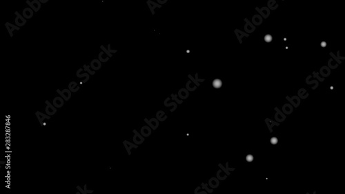 Snow white is falling through the black background in winter. Suitable for computer graphics effects in movie scenes., 4K video 