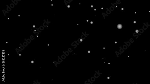Snow white is falling through the black background in winter. Suitable for computer graphics effects in movie scenes., 4K video 