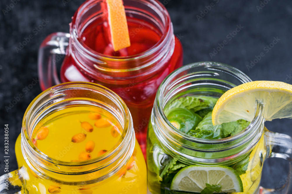 Lemonade or Mojito cocktail with lemon and mint, raspberry, sea buckthorn, grapefruit, cold refreshing drink or drink with ice Lemonade or Mojito cocktail with lemon and mint, raspberry, sea buckthorn, grapefruit, cold refreshing drink or drink with ice