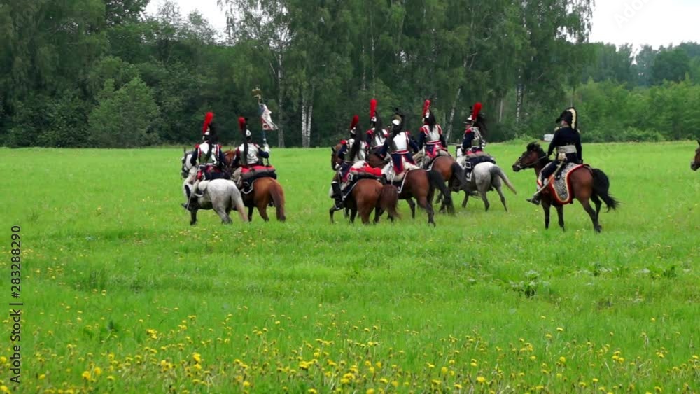 Horsemen. Cavalry squadron moves through the park to its position Horsemen. Cavalry squadron moves through the park to its position