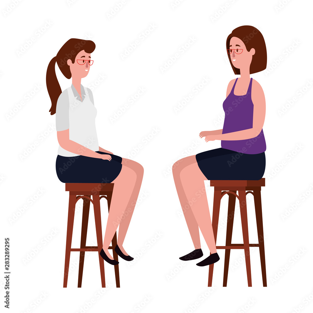 elegant businesswomen seated in benchs elegant businesswomen seated in benchs