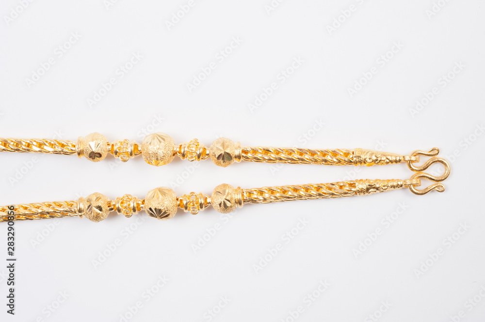 Gold chain necklace isolated on white background. Gold chain necklace isolated on white background.