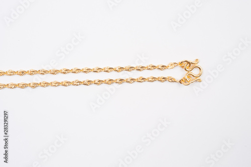 Gold chain necklace isolated on white background.