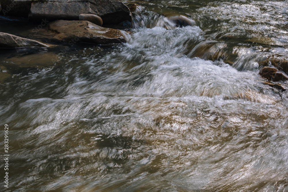 water flowing over rocks water flowing over rocks