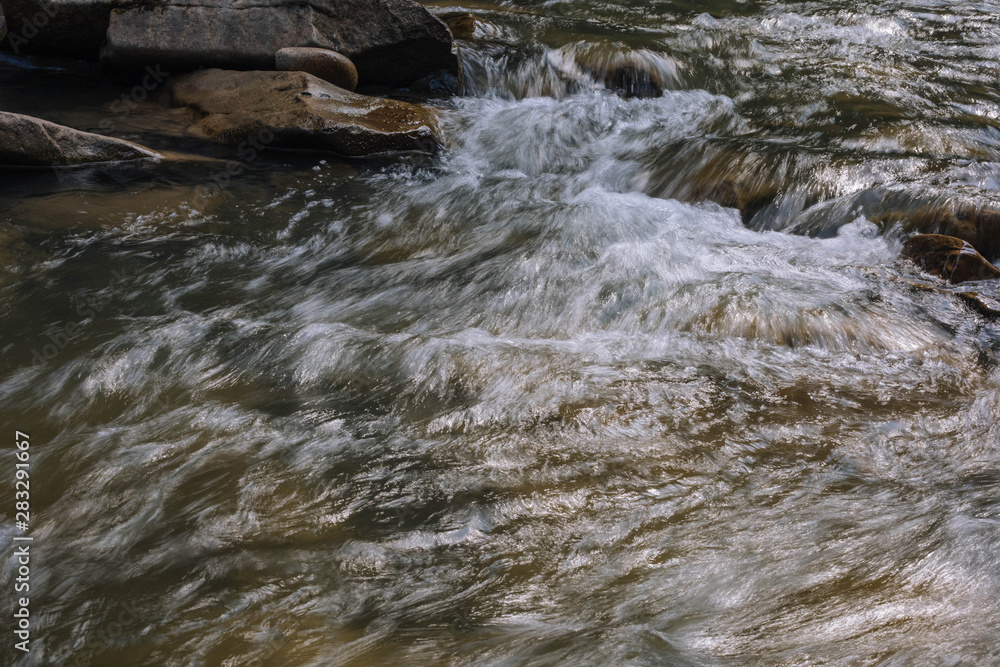 water flowing over rocks water flowing over rocks