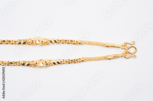 Gold chain necklace isolated on white background.