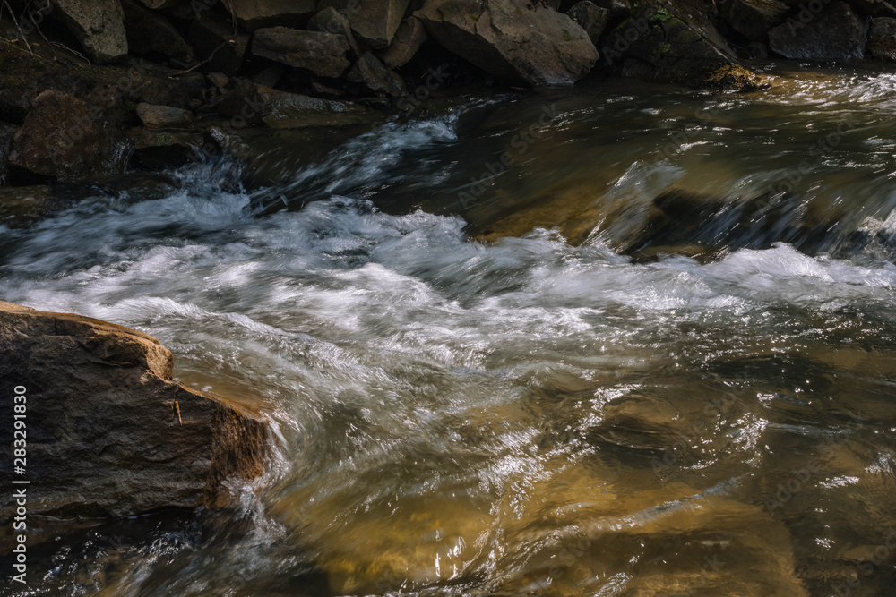 water flowing over rocks water flowing over rocks