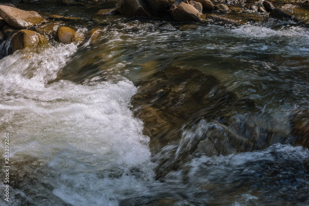 water flowing over rocks water flowing over rocks