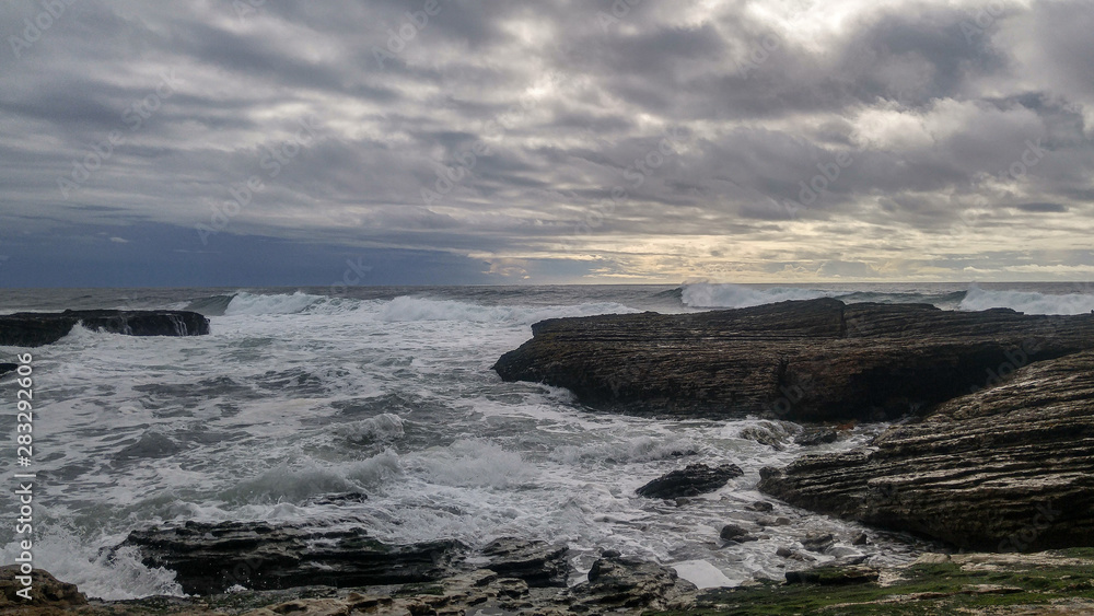 waves breaking on the rocks