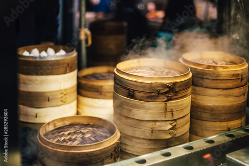 Piles of stacking bamboo steamers are steaming for dim sum. Street food of Jiantan in Taipei  Taiwan.