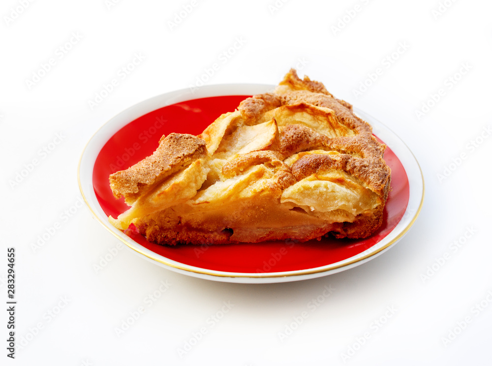 A piece of apple pie on the plate isolated on white background
