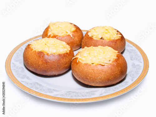 Pies with meat sprinkled with grated cheese