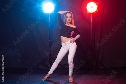 Young woman dancing in the dark, emotions and enjoyment