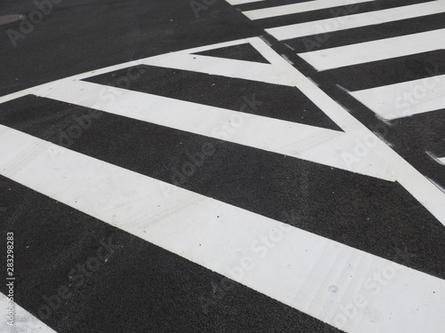 white traffic stripes painted on an asphalt road