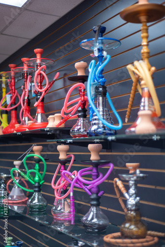 Colorful Hookah water pipes on shelf display