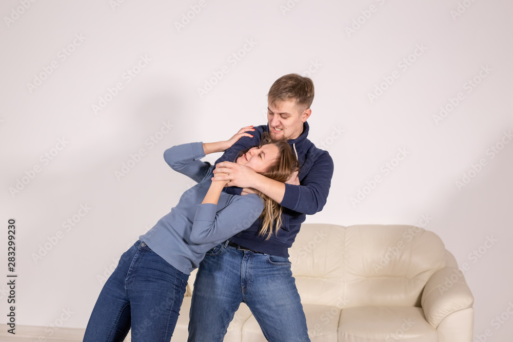 people, abuse and violence concept - agressive man strangling his wife people, abuse and violence concept - agressive man strangling his wife