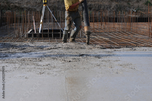 Concrete pouring during commercial concreting floors of buildings in construction