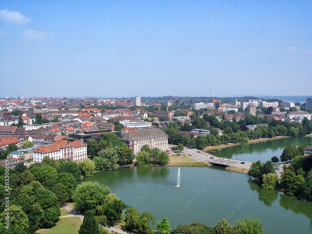 Aerial view over the center of Kiel city, the pond with fountain in the foreground. Schleswig-Holstein, northern Germany. Sunny summer day