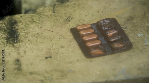 used medicine hospital tablets on a table top with cinematic painkiller photo