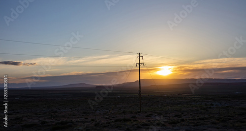 Sunset in a desert landscape, US. Blue sky background