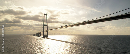 oresund bridge going from denmark to norway shot from a boat photo