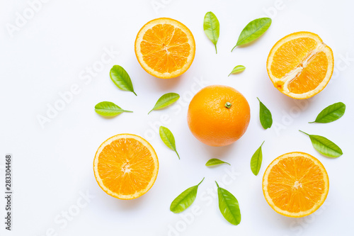 High vitamin C, Juicy and sweet. Fresh orange fruit with green leaves on white.