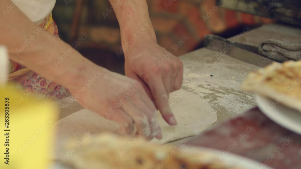 Man makes pita breads in local Bulgarian restaurant Man makes pita breads in local Bulgarian restaurant