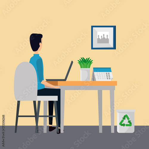man in office workplace scene with laptop