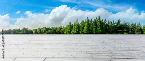 Empty square floor and green woods natural scenery in city park