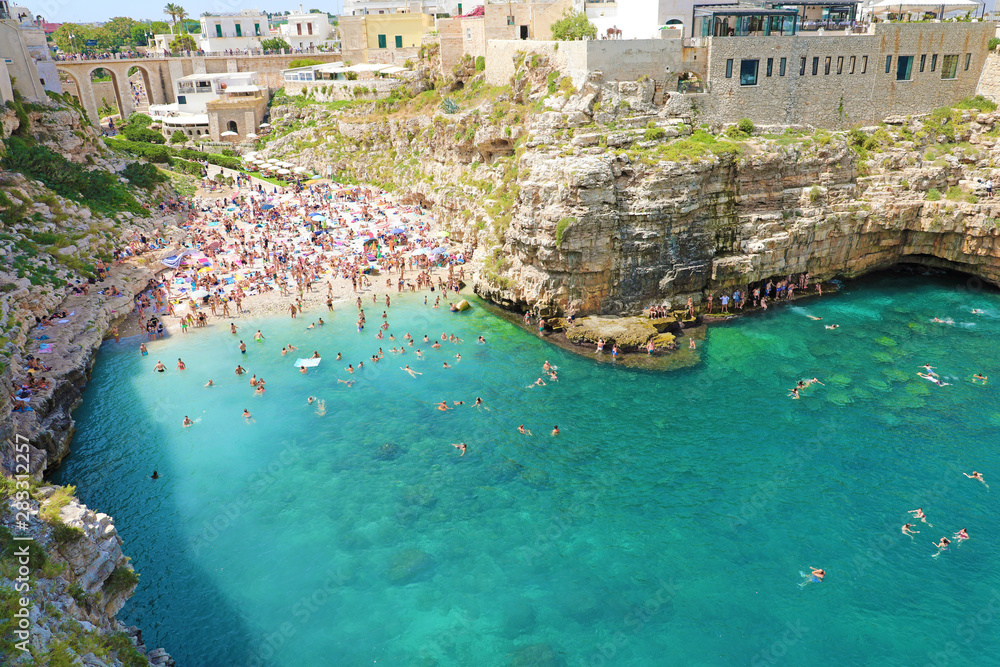 POLIGNANO A MARE, ITALY - JULY 28, 2019: beautiful aerial panoramic view of Polignano a mare, Italy
