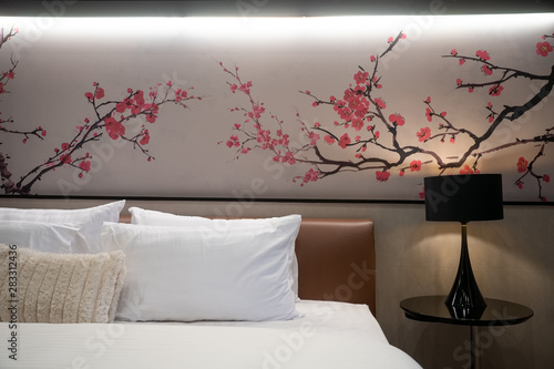 Elegant bedroom with white pillows and sheet