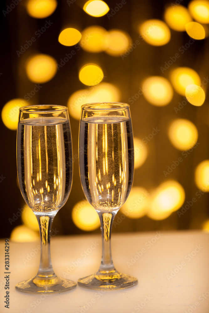 Glasses with a drink on a background of illumination Glasses with a drink on a background of illumination